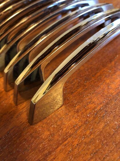 Set of twelve fluted chrome handles